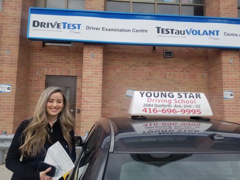 Young Star Driving School student celebrates passing their G2 road test in Toronto.